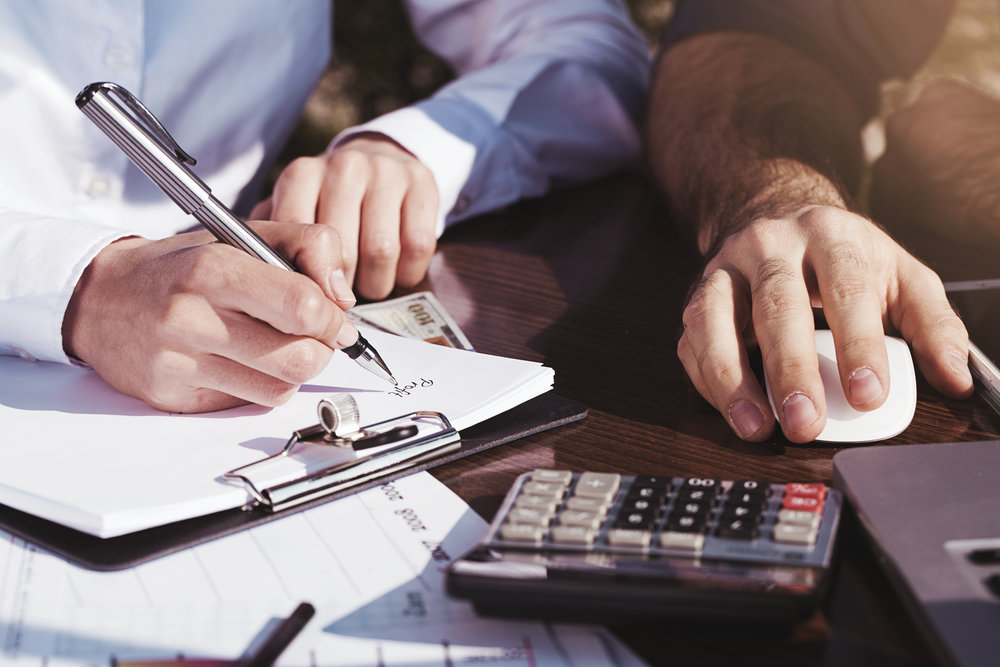 Office, business tools with dollars and calculator on table